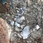 soil and stones while digging