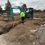 excavation project leading plumbing man working